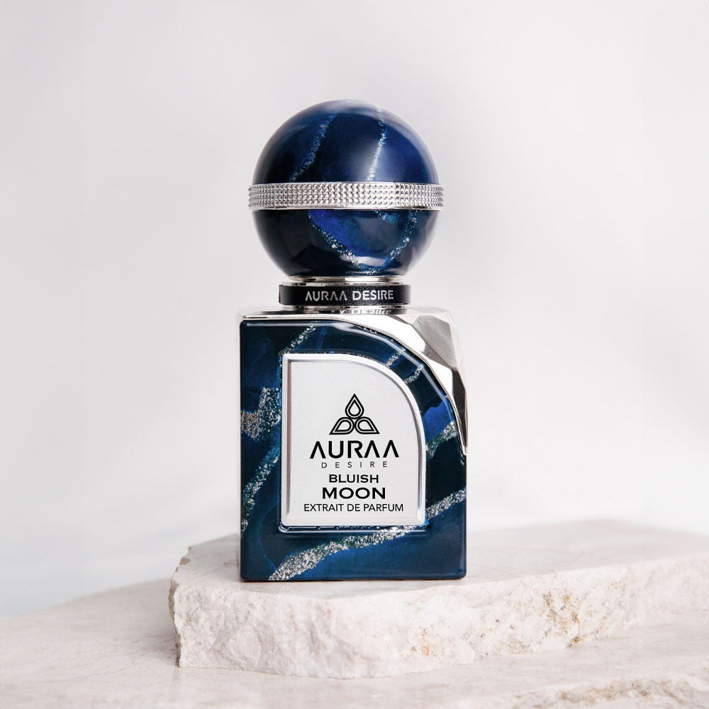 A blue perfume bottle from Auraa Desire by Savia Exclusive