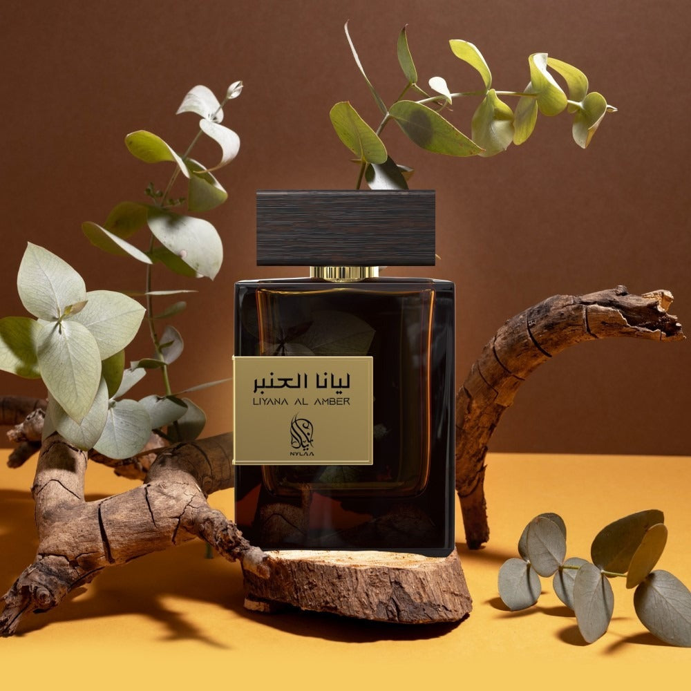 A brown perfume bottle poster from Nylaa by Savia Exclusive on a tree branch
