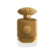 A light brown perfume bottle by Savia Exclusive with golden cap & white background