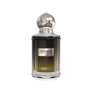A green & black perfume bottle by Savia Exclusive wih a silver cap & white background