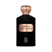 A black perfume bottle with a pink cap by Savia Exclusive