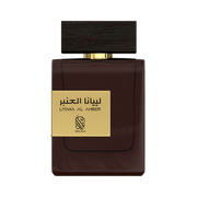 A dark brown perfume bottle by Savia Exclusive wth a black cap