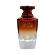 A brown & white perfume bottle by Savia Exclusive with white background