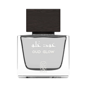 A transparent grey perfume bottle by Savia Exclusive with a black cap