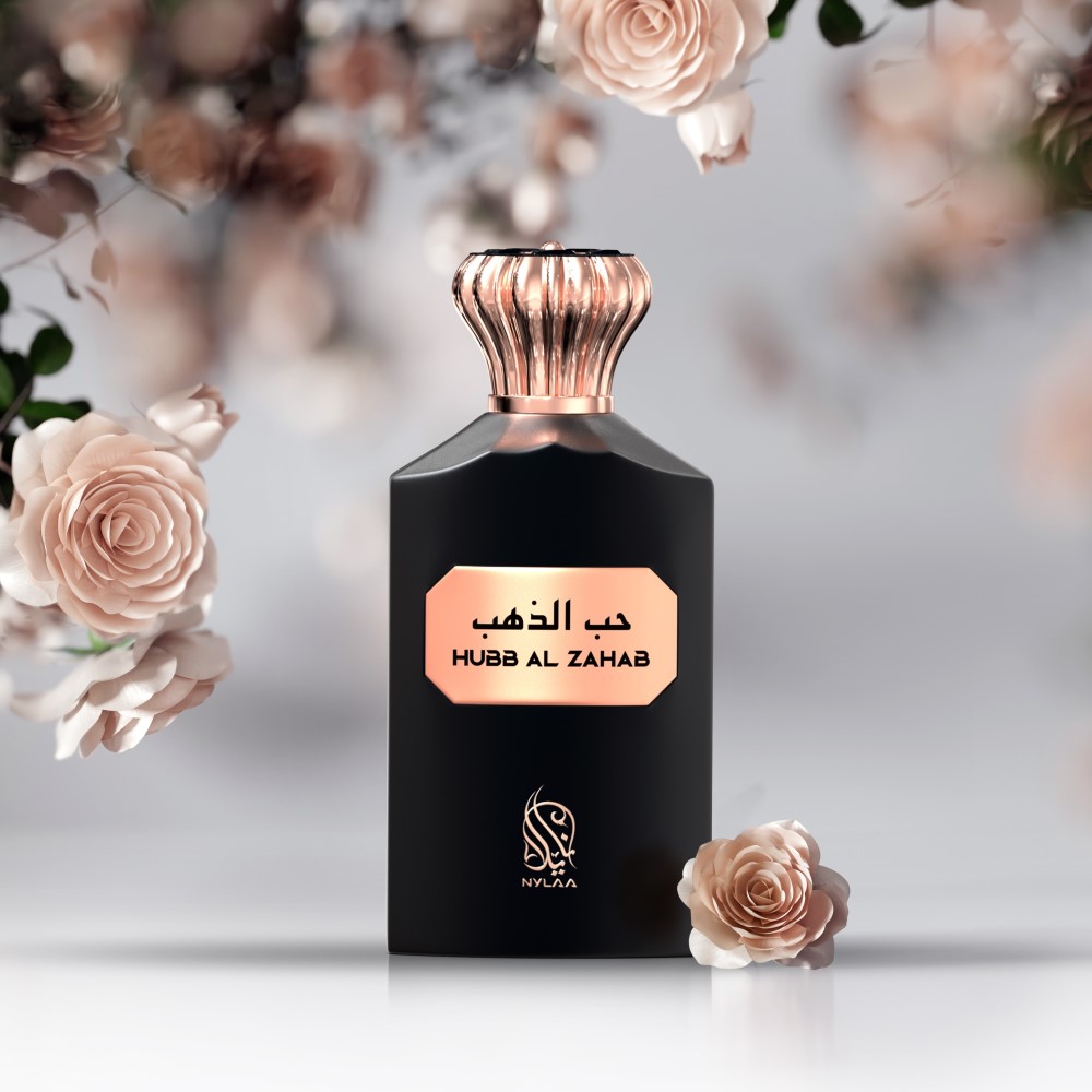 A black perfume bottle with a pink cap from Nylaa by Savia Exclusive surrounded by pretty pink roses