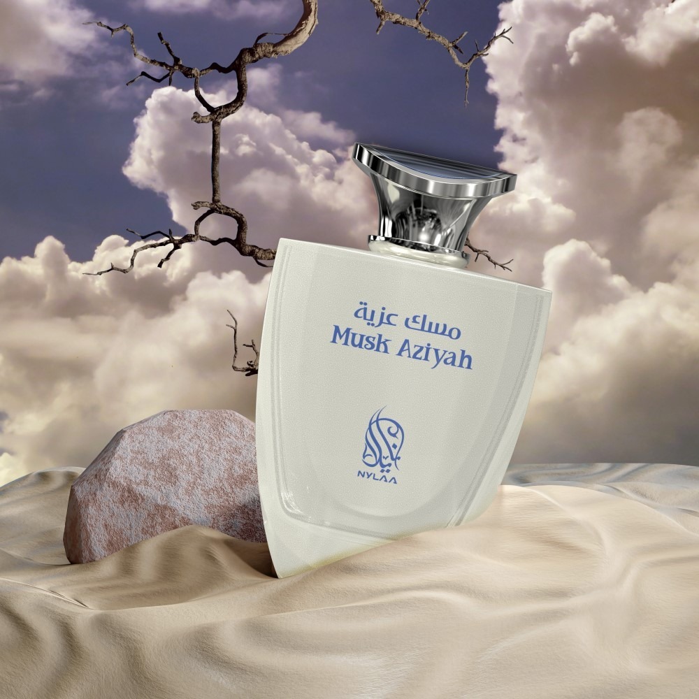 A white & blue perfume bottle poster from Nylaa by Savia Exclusive with clouds & branches in the background