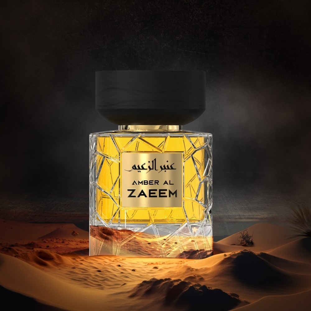 A golden perfume bottle poster from Nylaa by Savia Exclusive with a black cap in the desert