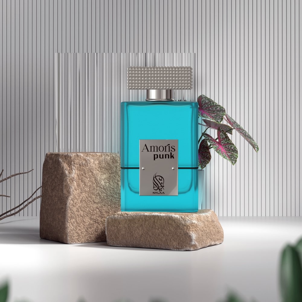 An ocean blue perfume bottle from Nylaa by Savia Exclusive placed against grey scaled background