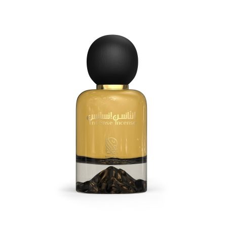 A golden perfume bottle with black round cap from Nylaa by Savia Exclusive