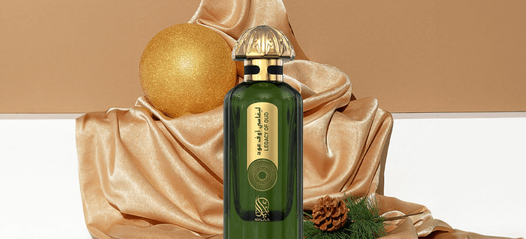 A green perfume bottle by Savia Exclusive with golden silk